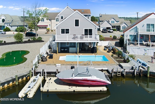 1043 Montauk Dr, Forked River, NJ 08731 - dock featuring a fenced backyard, a water view, boat lift, a balcony, and a residential view