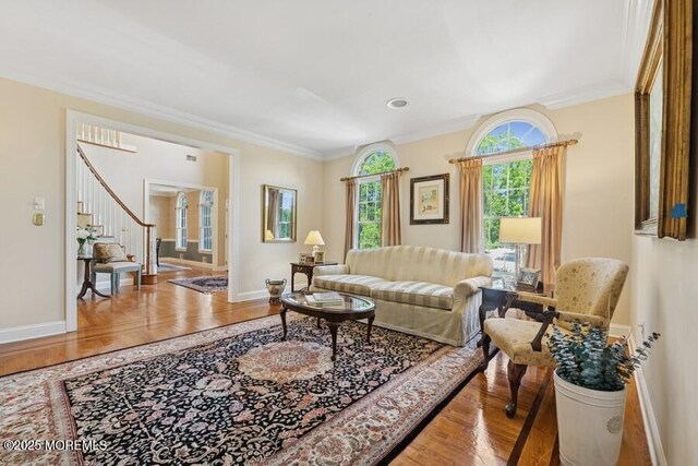9 Wide Horizons Dr, Colts Neck, NJ 07722 - living room featuring stairway, crown molding, and wood finished floors