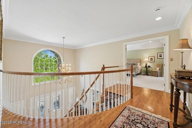 9 Wide Horizons Dr, Colts Neck, NJ 07722 - hall with a chandelier, an upstairs landing, wood finished floors, crown molding, and recessed lighting