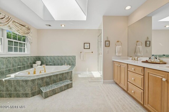 9 Wide Horizons Dr, Colts Neck, NJ 07722 - full bath with a garden tub, double vanity, tile patterned floors, a skylight, and recessed lighting
