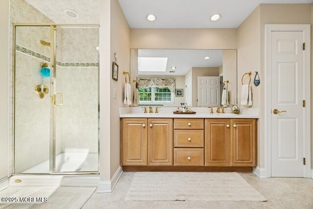 9 Wide Horizons Dr, Colts Neck, NJ 07722 - bathroom featuring a shower stall, double vanity, and a skylight