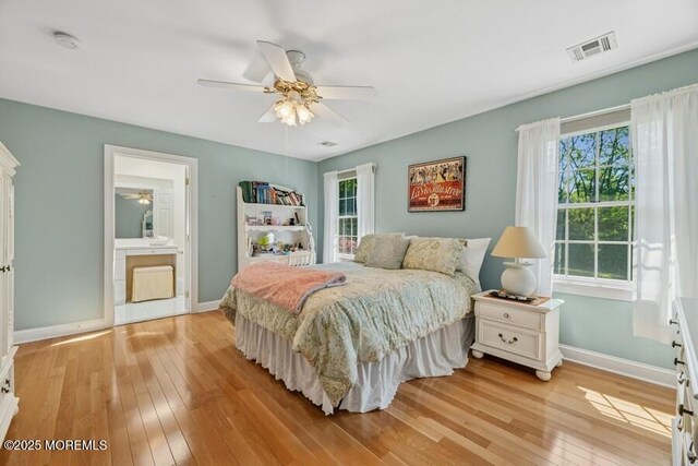 9 Wide Horizons Dr, Colts Neck, NJ 07722 - bedroom featuring light wood-type flooring, multiple windows, a ceiling fan, and connected bathroom