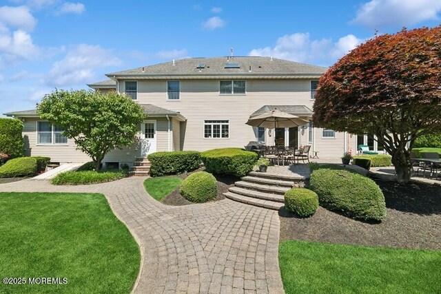 9 Wide Horizons Dr, Colts Neck, NJ 07722 - back of house featuring a patio, outdoor dining space, and entry steps