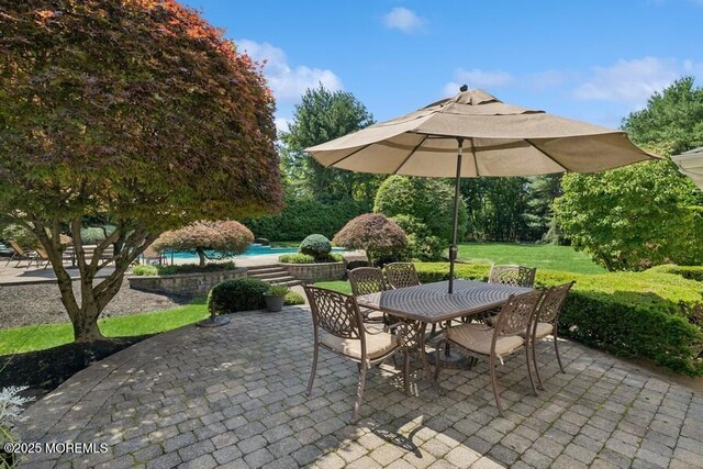 9 Wide Horizons Dr, Colts Neck, NJ 07722 - view of patio featuring outdoor dining space and an outdoor pool