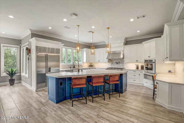 7 Rancho Polo, Colts Neck, NJ 07722 - kitchen featuring stainless steel appliances, under cabinet range hood, tasteful backsplash, light countertops, and white cabinets