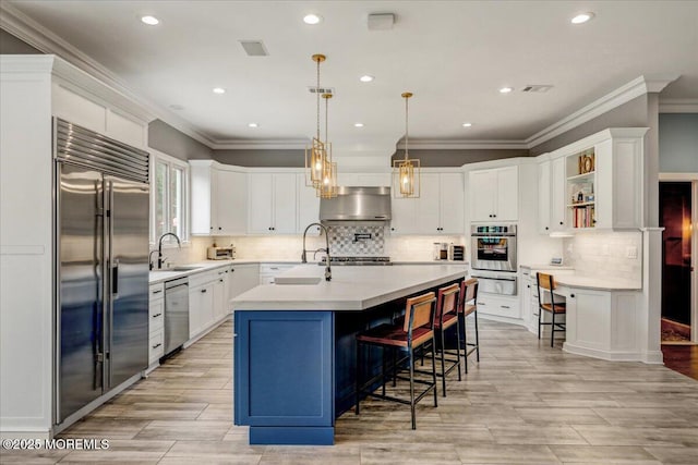 7 Rancho Polo, Colts Neck, NJ 07722 - kitchen with appliances with stainless steel finishes, ventilation hood, a kitchen breakfast bar, open shelves, and light countertops