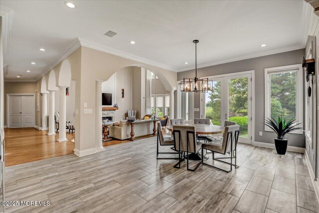 7 Rancho Polo, Colts Neck, NJ 07722 - dining area featuring arched walkways, recessed lighting, a chandelier, decorative columns, and light wood finished floors