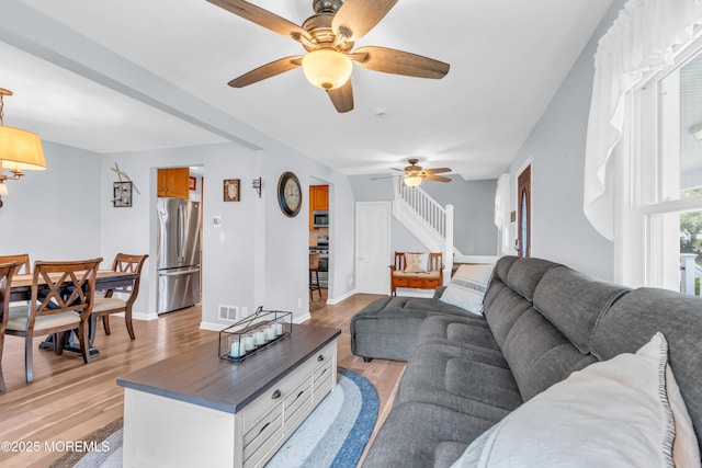 502 Corlies Ave, West Allenhurst, NJ 07711 - living area featuring a ceiling fan, light wood-style flooring, and stairs