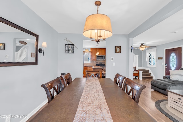 502 Corlies Ave, West Allenhurst, NJ 07711 - dining room with stairway, wood finished floors, and ceiling fan