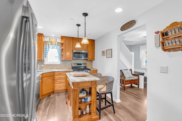 502 Corlies Ave, West Allenhurst, NJ 07711 - kitchen with stainless steel appliances, open shelves, light countertops, a center island, and recessed lighting