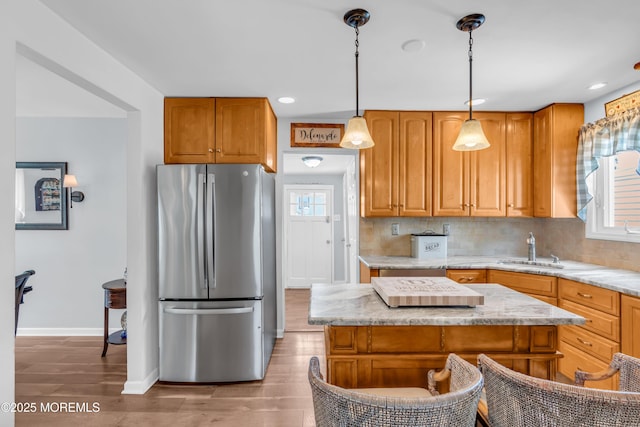 502 Corlies Ave, West Allenhurst, NJ 07711 - kitchen featuring freestanding refrigerator, backsplash, light wood finished floors, recessed lighting, and decorative light fixtures