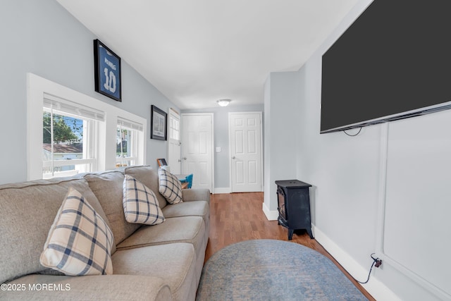 502 Corlies Ave, West Allenhurst, NJ 07711 - living room with wood finished floors and a wood stove