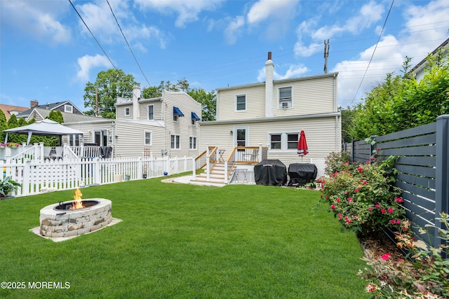 502 Corlies Ave, West Allenhurst, NJ 07711 - rear view of house with an outdoor fire pit, a gazebo, a fenced backyard, and a chimney