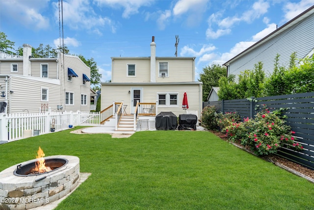 502 Corlies Ave, West Allenhurst, NJ 07711 - back of property featuring a fire pit, a fenced backyard, and a deck