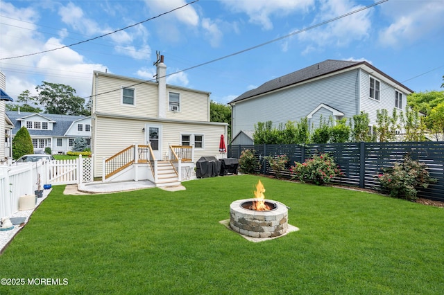 502 Corlies Ave, West Allenhurst, NJ 07711 - rear view of house with a fire pit, a fenced backyard, a chimney, and a gate