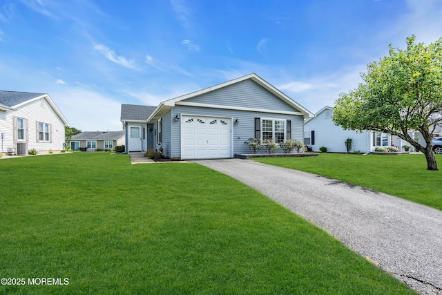 28 Greenbriar Blvd, Brick, NJ 08724 - single story home with an attached garage, asphalt driveway, and a front lawn