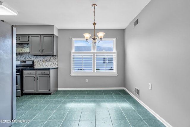 28 Greenbriar Blvd, Brick, NJ 08724 - kitchen with gray cabinets, stainless steel appliances, a chandelier, dark countertops, and tile patterned flooring