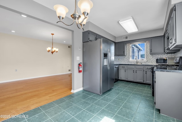 28 Greenbriar Blvd, Brick, NJ 08724 - kitchen featuring appliances with stainless steel finishes, a chandelier, gray cabinetry, dark countertops, and recessed lighting
