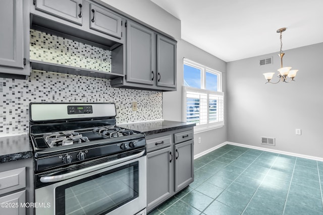 28 Greenbriar Blvd, Brick, NJ 08724 - kitchen with gas stove, gray cabinets, a chandelier, and backsplash