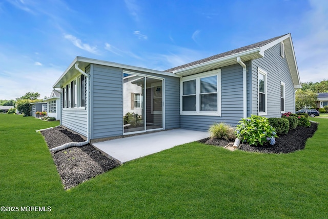 28 Greenbriar Blvd, Brick, NJ 08724 - back of property featuring a lawn and a patio