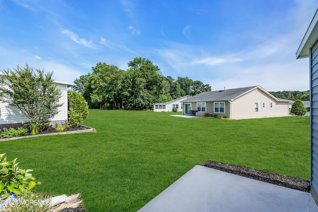 28 Greenbriar Blvd, Brick, NJ 08724 - view of grassy yard featuring a patio