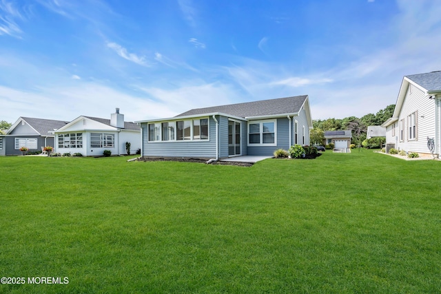 28 Greenbriar Blvd, Brick, NJ 08724 - view of front facade featuring a front yard and a patio area