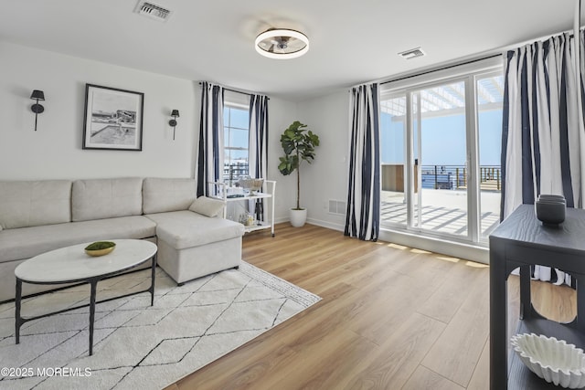 33 Hamilton Ave Unit 7, Seaside Heights, NJ 08751 - living room with light wood finished floors and baseboards