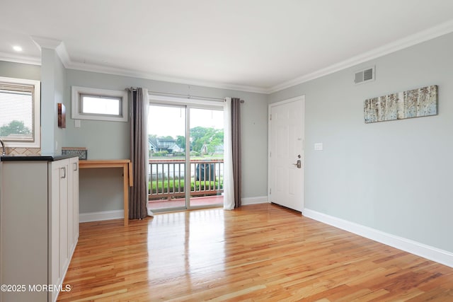 1641 Elm Ave Unit 10, Point Pleasant, NJ 08742 - unfurnished living room featuring ornamental molding and light wood-style flooring