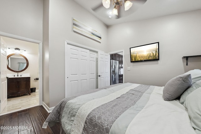 32 Langeveld Dr, Freehold, NJ 07728 - bedroom featuring stainless steel fridge with ice dispenser, wood finished floors, a closet, a towering ceiling, and connected bathroom