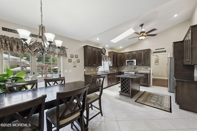 32 Langeveld Dr, Freehold, NJ 07728 - dining room featuring lofted ceiling, a ceiling fan, light tile patterned flooring, a chandelier, and recessed lighting
