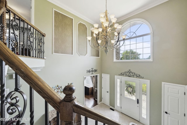 32 Langeveld Dr, Freehold, NJ 07728 - foyer with a chandelier, ornamental molding, light tile patterned floors, stairway, and a towering ceiling