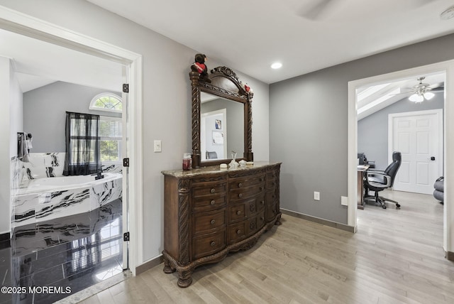 32 Langeveld Dr, Freehold, NJ 07728 - full bathroom with a ceiling fan, vaulted ceiling, vanity, wood finished floors, and recessed lighting