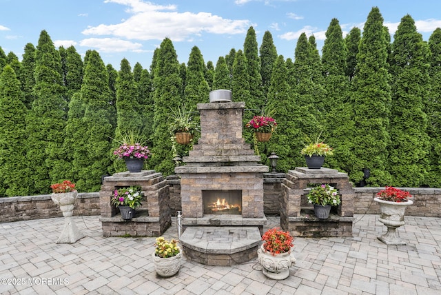 32 Langeveld Dr, Freehold, NJ 07728 - view of patio / terrace featuring an outdoor stone fireplace