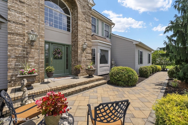 32 Langeveld Dr, Freehold, NJ 07728 - doorway to property featuring brick siding