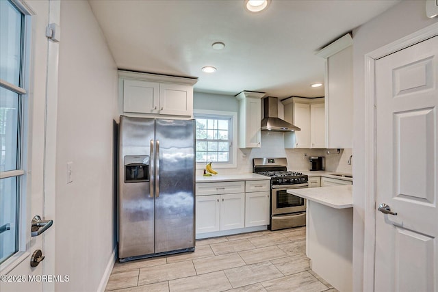 296 High St, Metuchen, NJ 08840 - kitchen with stainless steel appliances, wall chimney range hood, light countertops, backsplash, and recessed lighting