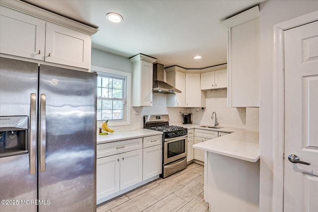 296 High St, Metuchen, NJ 08840 - kitchen with stainless steel appliances, wall chimney range hood, decorative backsplash, recessed lighting, and light stone counters