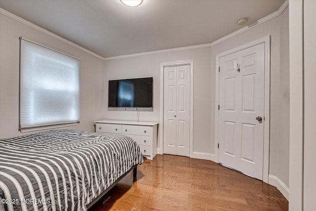 296 High St, Metuchen, NJ 08840 - bedroom with wood finished floors, ornamental molding, and a closet