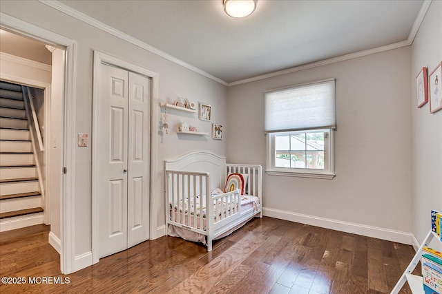 296 High St, Metuchen, NJ 08840 - bedroom featuring a closet, dark wood-style flooring, and crown molding