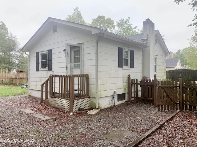 97 Vine St, Bayville, NJ 08721 - rear view of house with a chimney