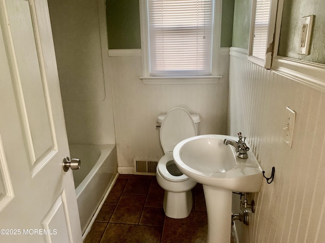 97 Vine St, Bayville, NJ 08721 - bathroom featuring tile patterned flooring, a tub to relax in, wainscoting, plenty of natural light, and a shower
