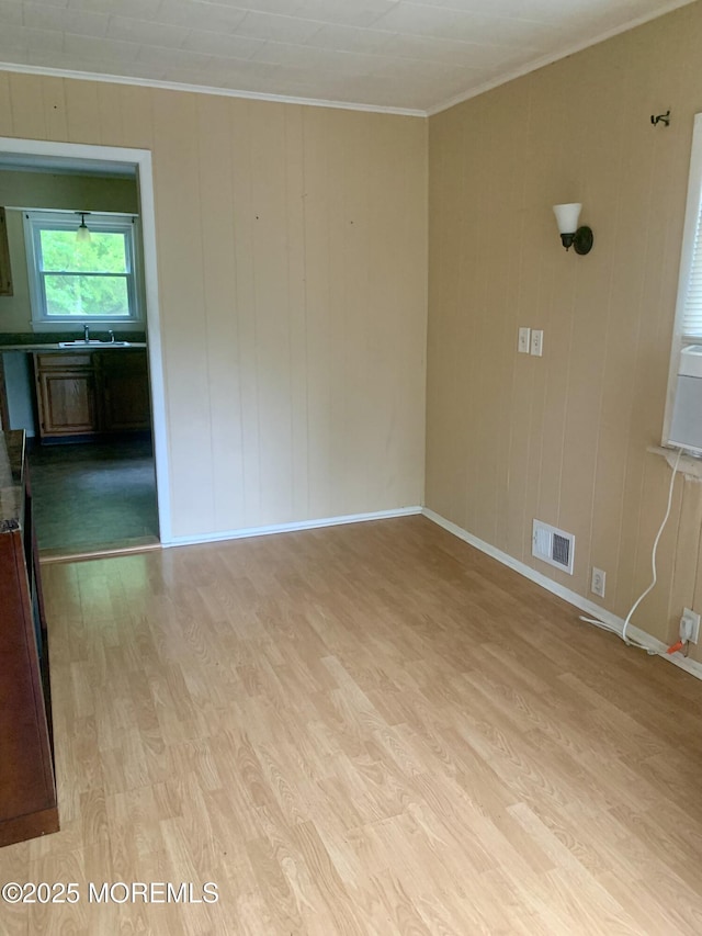 97 Vine St, Bayville, NJ 08721 - empty room with ornamental molding and light wood finished floors