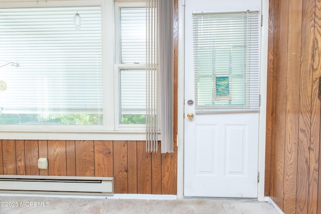 30 Sherwood Ln, Toms River, NJ 08757 - doorway to outside with a baseboard heating unit and wooden walls