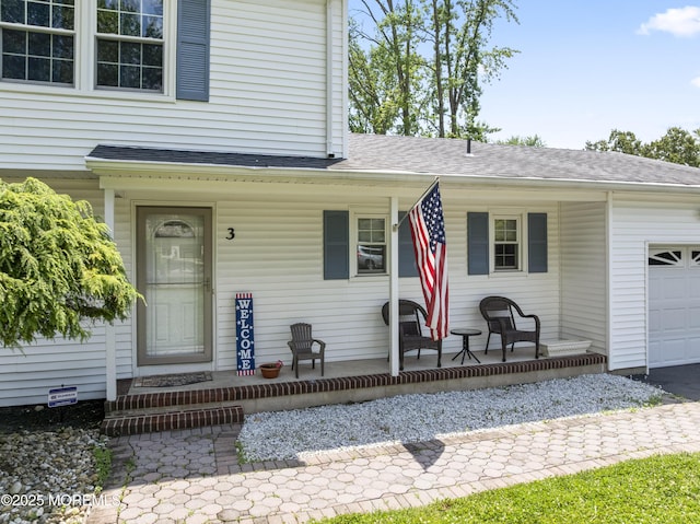 3 Thompson Ln, Manalapan, NJ 07726 - property entrance featuring a porch, an attached garage, a shingled roof, and driveway