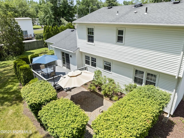 3 Thompson Ln, Manalapan, NJ 07726 - back of property with roof with shingles, a deck, outdoor dining area, and a patio area