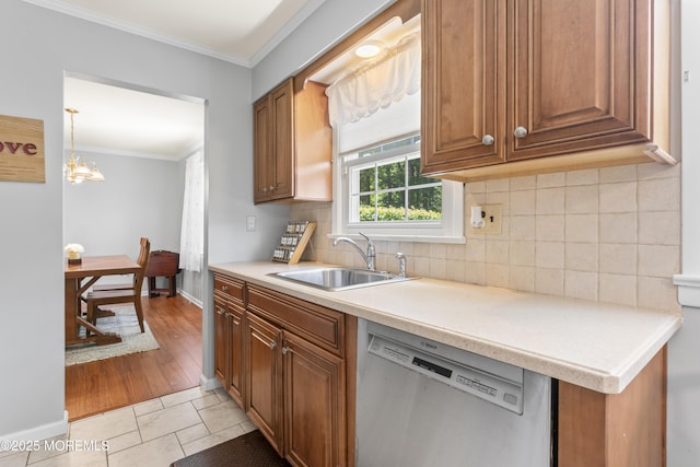 3 Thompson Ln, Manalapan, NJ 07726 - kitchen with dishwasher, crown molding, brown cabinetry, light countertops, and backsplash