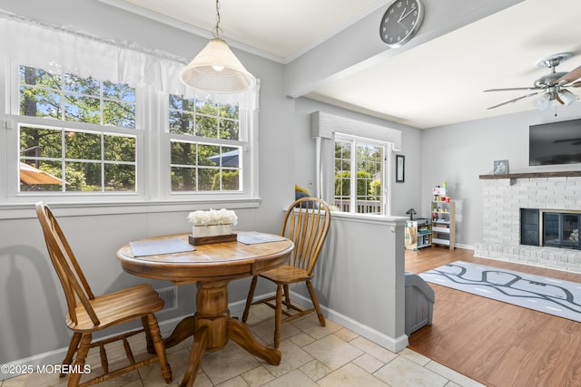 3 Thompson Ln, Manalapan, NJ 07726 - dining room with ornamental molding, ceiling fan, and a brick fireplace
