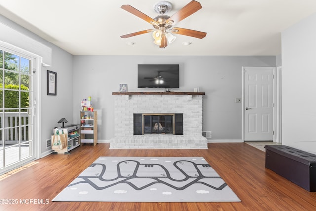 3 Thompson Ln, Manalapan, NJ 07726 - living room featuring ceiling fan, a fireplace, and wood finished floors