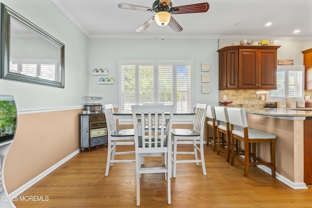 734 S River Dr, Forked River, NJ 08731 - dining area with a ceiling fan, healthy amount of natural light, ornamental molding, light wood-style floors, and recessed lighting