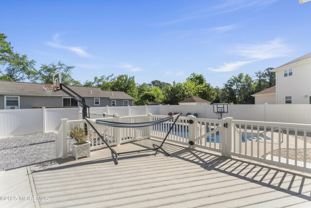 734 S River Dr, Forked River, NJ 08731 - wooden deck with a fenced backyard and a patio