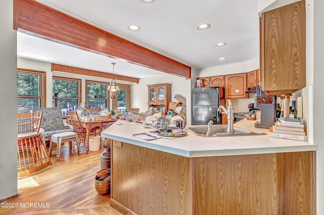 538 Perrineville Rd, Jackson, NJ 08527 - kitchen with freestanding refrigerator, recessed lighting, a peninsula, light countertops, and beamed ceiling